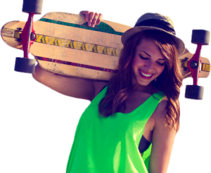 teen smiling holding skateboard