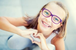 kids with braces after meeting our kids orthodontist Brooklyn