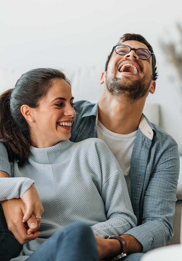 Smiling couple after getting Orthodontic Care from our orthodontist Brooklyn